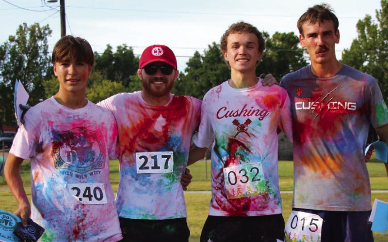 Color run winners stand from left, fourth place Gage Hoover, third place Vincent Eremita, second place Fisher Moore, and first place Kamo Evans. Photo by Allie Prater.
