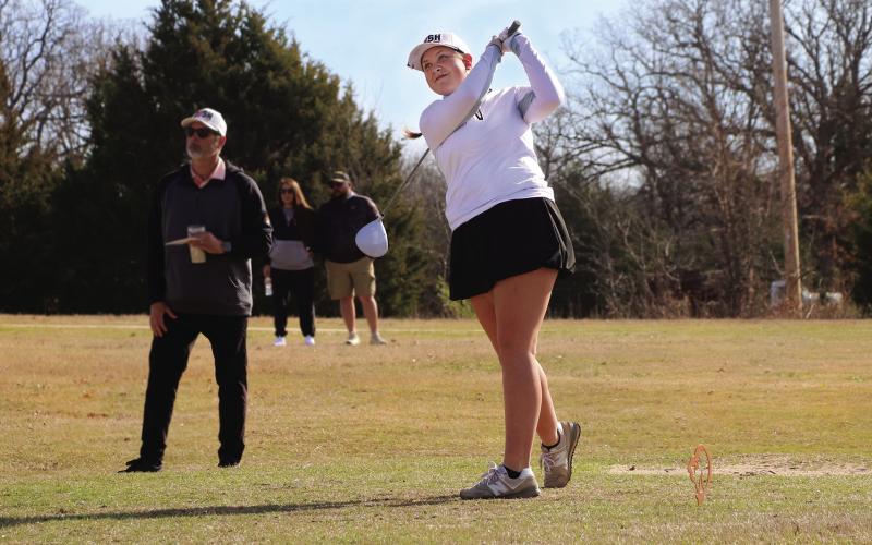 Cushing Lady Tiger freshman Ayla Britt hits a drive from the tee box during the Cushing Girls Spring Invitational Tournament at Buffalo Rock Golf Course Monday, March 24. See story page 7. Photo by Allie Prater.