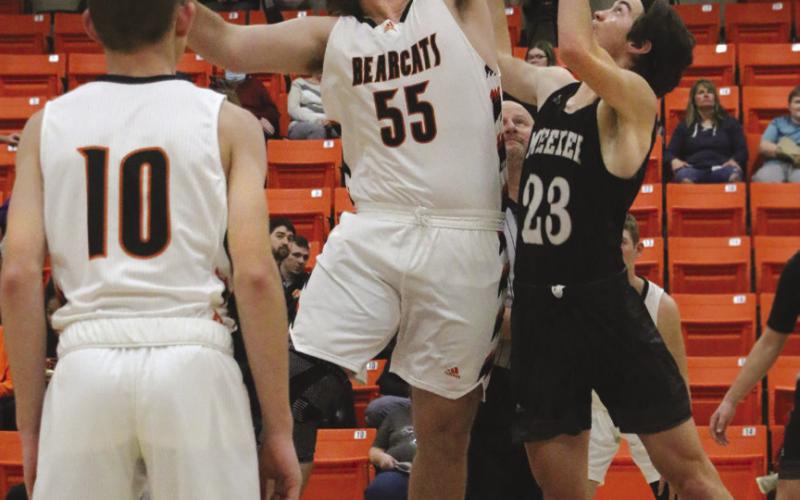 Agra Bearcat Bryson Howard wins the tip off agains Meeker Bulldog Ean Watham Bearcats game against the Dawgs during the Agra invitation tournament Friday, Dec. 9.