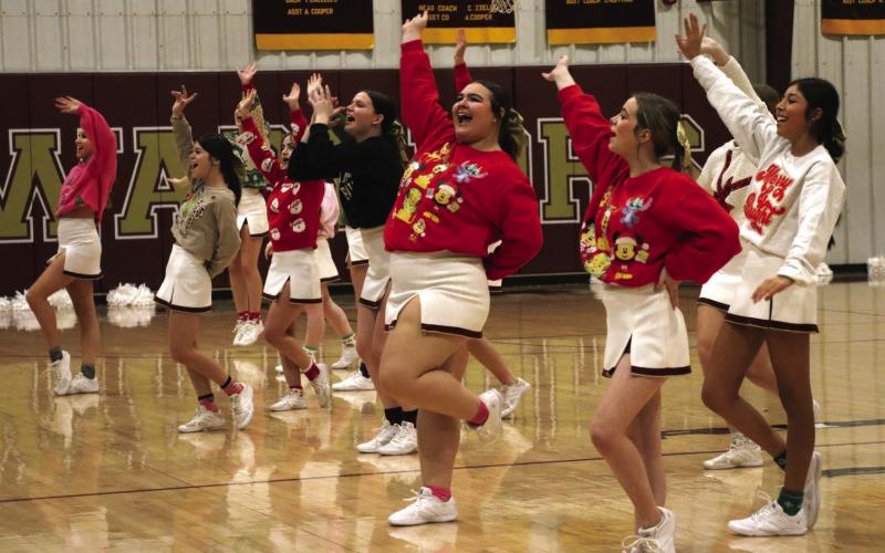 The Ripley Cheer squad hypes up the crowd after the Lady Warriors game against the Earlsboro Lady Wildcats. Photos by Allie Prater