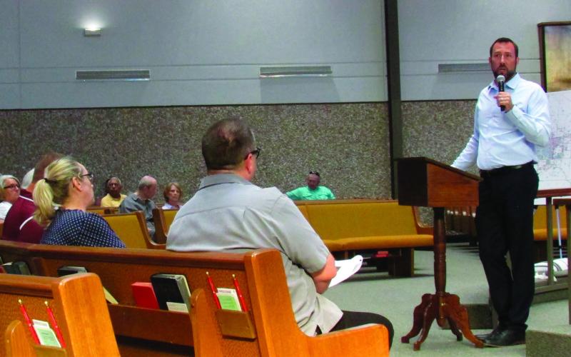 City of Cushing Chairman B.J. Roberson gives a presentation on the financial stability of the city before opening the town hall meeting on June 13 to questions. Photo by DeAnna Maddox