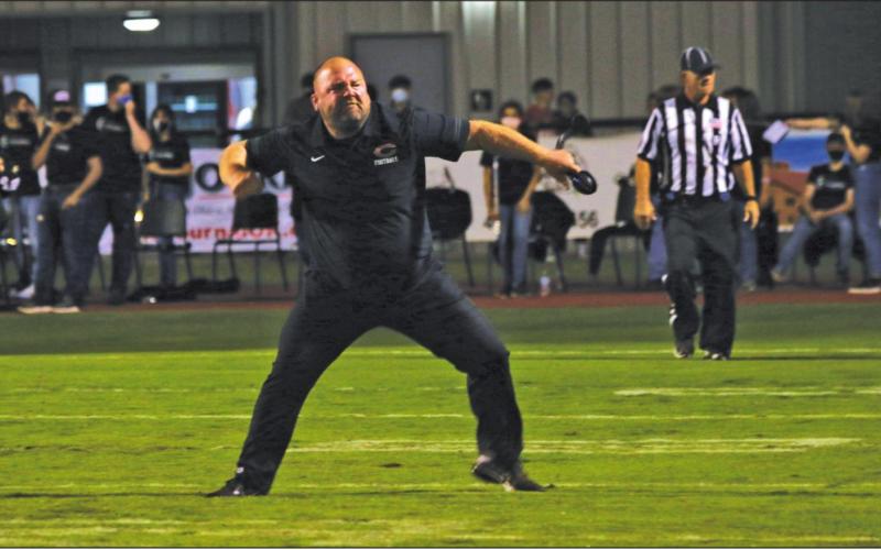 Tiger Head Coach Rusty Morgan celebrates a key red-zone defensive stop Friday in Perkins.