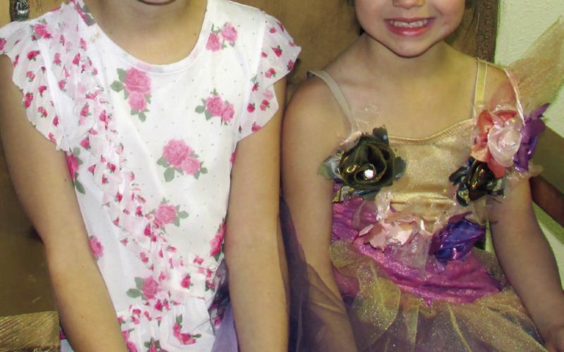 Addie Fox and Mia Fox sit upon a golden throne dressed in their best garb while participating in the Cushing Public Library’s annual Tolkien Week event, the Hobbit Party. Participants earned tickets to the party by following riddles and clues in relation to the J.R.R. Tolkien written series that follows the adventures of Bilbo Baggins. More on page 10. Photo by DeAnna Maddox