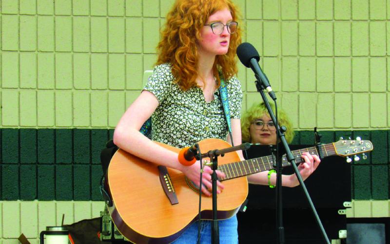Bekah Beasley preformed an original piece titled “Winter Again” with acoustic accompaniment also composed by the young artist on stage at Festival in the Park. Photos by DeAnna Maddox