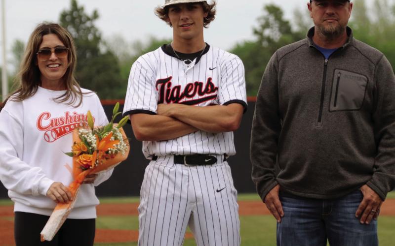 Gage Lovin escorted by parents Michael and Kelly Levin.