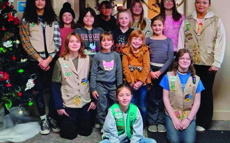 Troop #79 stand together after working diligently to spread Christmas cheer by decorating the Cushing Marketplace. Pictured: back row (L to R): Audrey Roberson, Sadie Maxwell, Tegan Fincher, Arhyanna Tusler, Willow Keyes. Middle row (L to R): Brooklynn Pierce, Teagan Williams, Addilyn Fox, Alexa Page. 3rd row (L to R): Addison Kidder, Mia Fox, Cora Doak, Alice Green. Front: Everley Ewy. Photo courtesy of Laura Green.