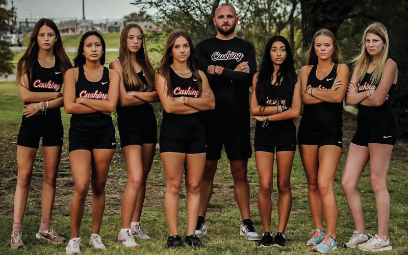 The Lady Tigers tied a school record with their 13th-place finish and Amaya Grant finished third. Pictured are: Grant, Morgan Franklin, Emory Eyler, Melannie Townes, Head Coach Josh Greer, Yohali Medrano, Cora Eyler and Brooklyn Burden. Photos by Sarah Townes