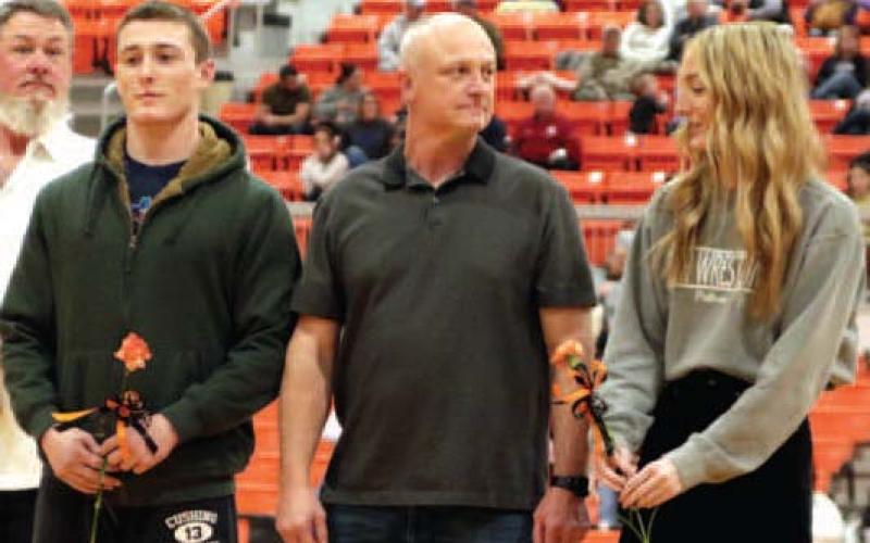 Kobe and Kinzie Smith escorted by Robert Smith.