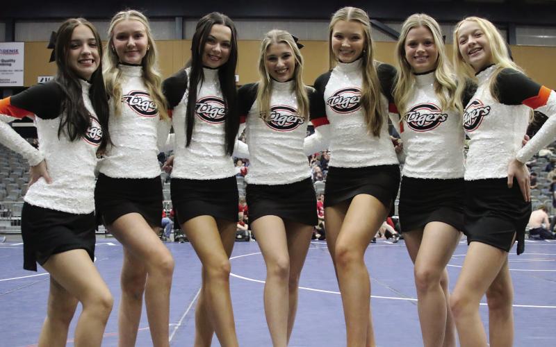 Cushing Cheerleaders Ellie Andrews, Gracie Hickman, Anna Mae Nighswonger, Ava Babinec, Brittan Blakemore, Presley Elliott, and Anisten Campbell at the 2024 Dual State Wrestling tournament Friday, Feb. 9. Photo by Allie Prater