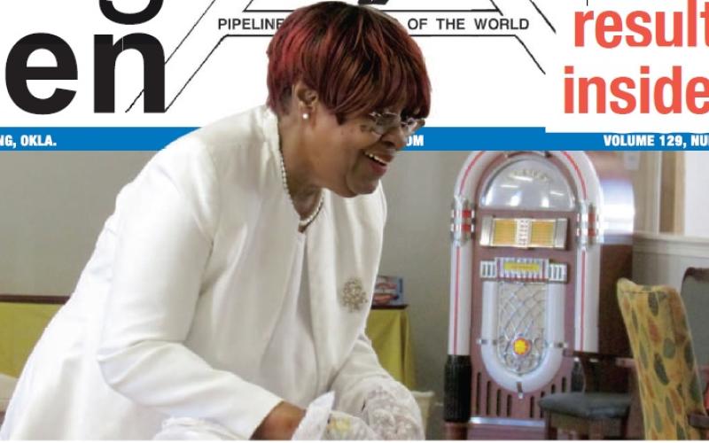 Worthy Matron of Chapter #48 Lady Talliaferro branch of the Order of the Eastern Star Lynda McPheters shares the love with Linwood Village residents by passing out socks with hearts in her OES uniform — white clothes, pearls, fl owers, and gloves with the OES emblem — on Valentine's Day last week. Photo by DeAnna Maddox.