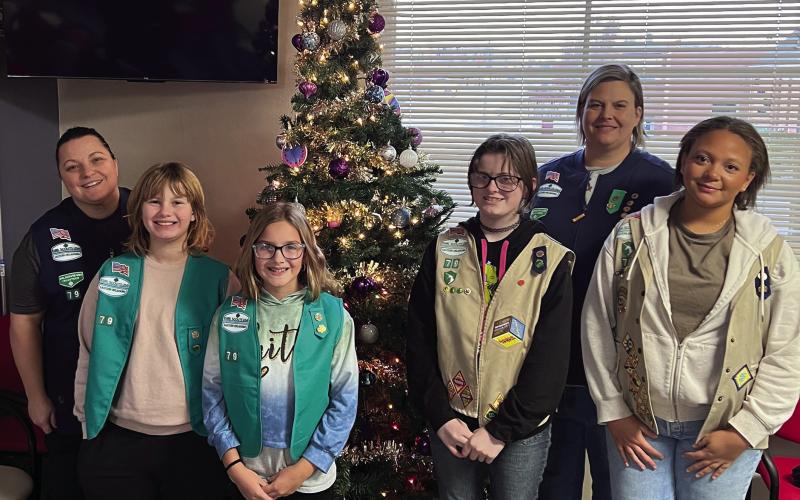 Girl Scout Troop 790 went to the Cushing Marketplace last Sunday on Nov. 30 to decorate for Christmas. Pictured in back is Troop Leader Laura Green and Co-Leader Karen Schmitt-Page. Troop members pictured from left are Vivian Richard, Addison Fox, Alice Green, and Alexa Page. Other members who helped with the recent donation drive but was unable to decorate are Sadie Maxwell, Arhyanna Tusler, Rhylynn Garcia, Teresalynn Parson, and Brooklyn Pierce.