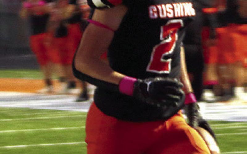 Tiger cornerback Lane Yaunt jogs into the end zone after he intercepted a McLain pass at their own 12 yard line.