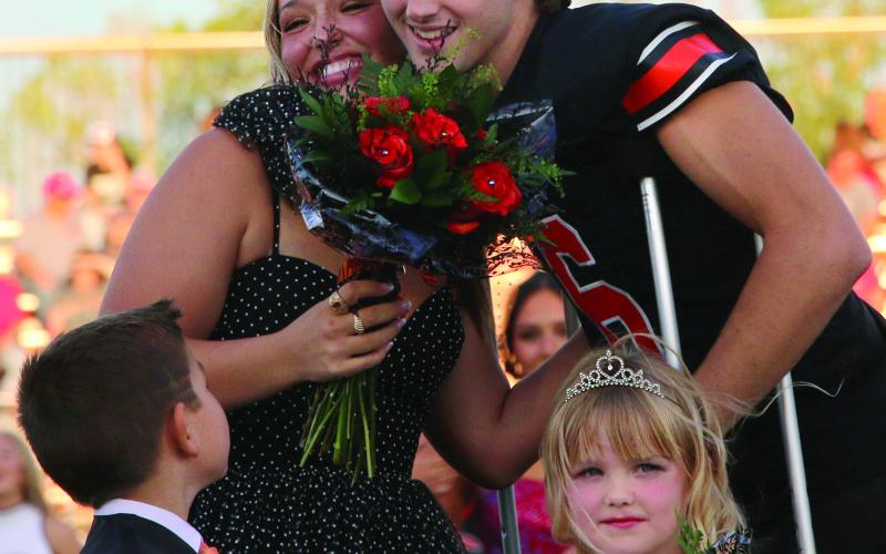 Max Wood and Maddie Collier celebrate after being crowned 2024 Cushing Tiger Homecoming King and Queen during homecoming festivities Friday night while crown bearer Kannon Fowler and flower girl Landry Morgan look on. Photo by Allie Prater. More photos page 12.