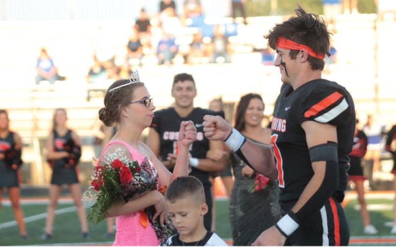 Cushing Tiger 2023 Football Homecoming Queen Kaylin Beitz fist bumps King Brady Matheson after coronation at the Tigers Homecoming game against the Miami Wardogs. Tigers beat the Wardogs 40-28, see full story inside. Photo by J.D. Meisner.
