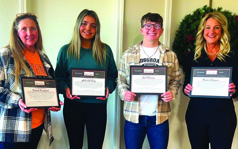 Cushing Chamber of Commerce President and CEO Tracy Caulfield celebrated the chamber’s “Business After School, November honorees Monday with a reception in their honor. Selected for the Month of November were, from left, Teacher of the Month Brandi Brichacek, Cushing Middle School science teacher; Student of the Month Gabriella Craig, Student of there Month Carl Peterson; and Support Employee of the month Rachael Simpson, Cushing Upper Elementary teaching assistant. Photo by J. D. Meisner