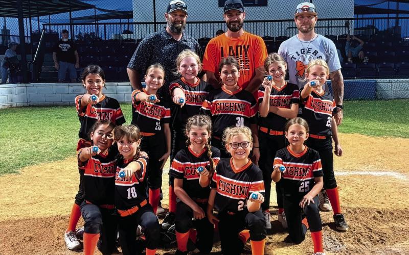 The Cushing Lady Tiger 8U softball team finished the season with an impressive 13-4 record and earned runner-up honors in the end-of-season tournament. They are, back row from left, Erik Brown, Jacob Westmoreland and Dustin Kelly. Middle row from left, Malia Rockwell, Kannyn Brown, Hadley Morgan, Athena Ka’ne, Gentry Westmoreland and Clare Delong. Front row from left, Ivette Cruz, Mia Fox, Taya Kelly, Reese Laurdale and Loxi Busby.
