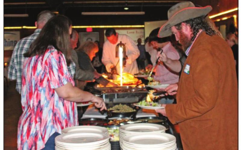 A hungry crowd lined up for some Steer Inn pork loin and brisket.