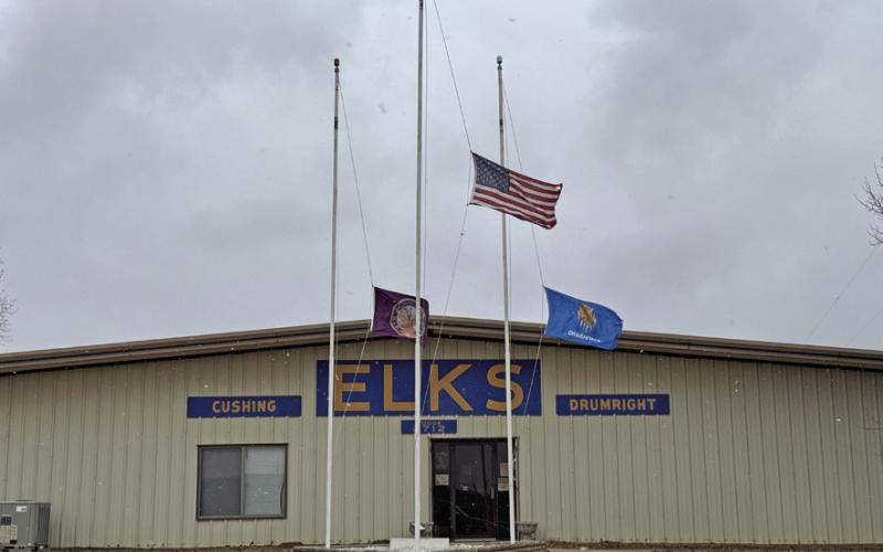 Flags at the Cushing-Drumright Elks Lodge fly at half mast during the snow storm Sunday, Jan. 5. Photo by Allie Prater