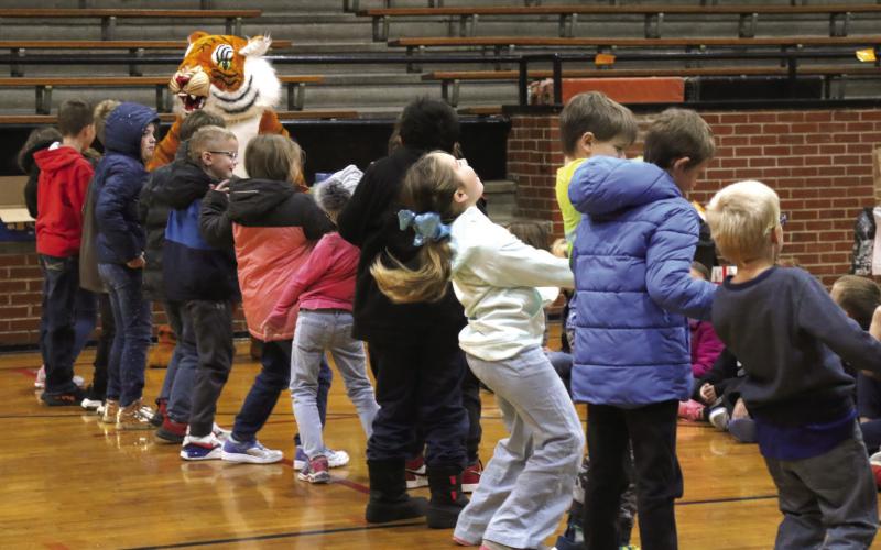 Cushing second graders do the “cobweb shimmy” with Tony the Tiger during P.E. on Tuesday, Oct. 31. Photos by Allie Prater