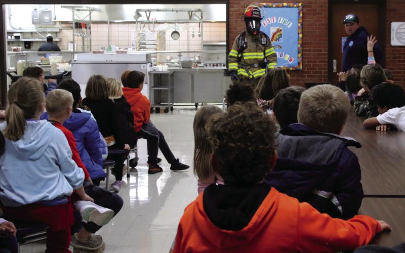 Members of the Cushing Fire Department speak with Cushing second graders about fire safety and show off their bunker gear on Tuesday, Oct. 31.