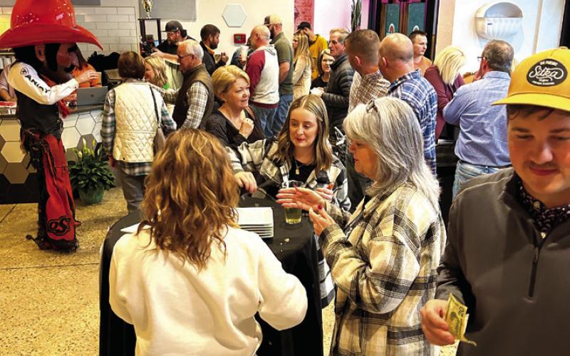 The near-capacity crowd enjoys their spaghetti dinners during the Tyler Study fundraiser Sunday.