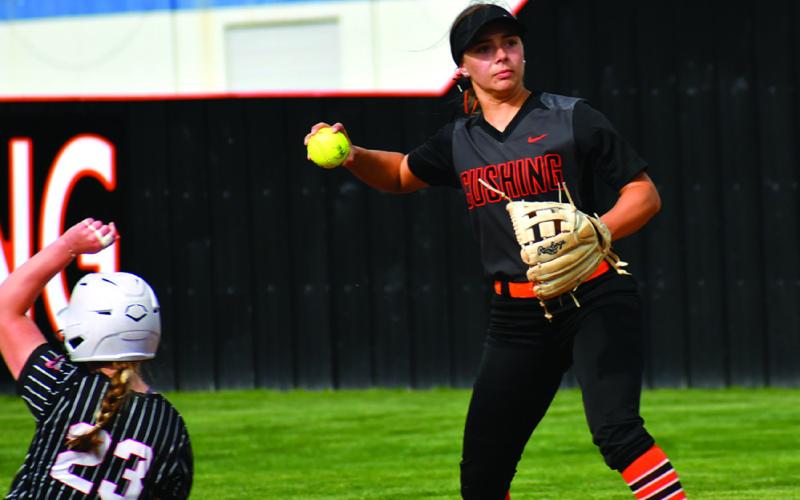 Lady Tiger Melanie Townes makes a throw to first. Photos by Sarah Townes