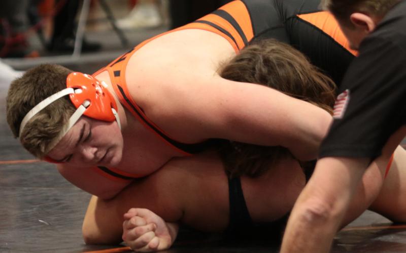 Tiger Aaron Vieyra pins Landon Schroeder of Kingfisher. photo by J. D. Meisner
