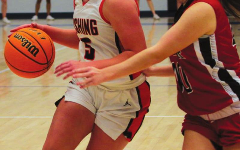 Lady Tiger Maddie Alexander dribbles past a Luther defender. Photo’s by J.D. Meisner.