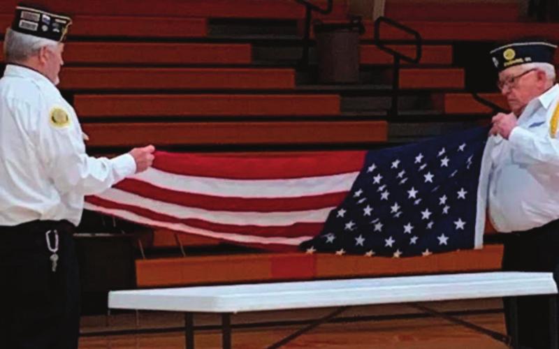 Veterans Dennis Fisher and James Medlock performed a flag folding ceremony during the Agra Public School Veterans Day assembly held on Thursday, Nov. 11.