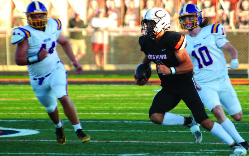 Blaze Berlowitz shows his versatility as he scrambles out of the pocket and runs to a first down Friday.