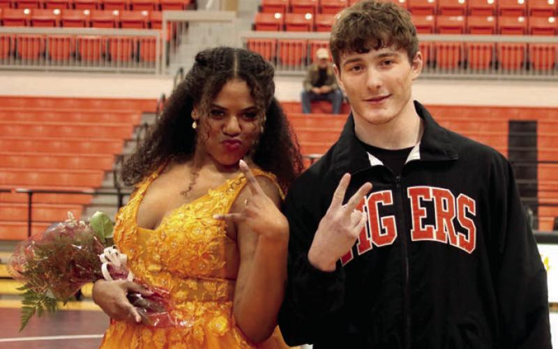 Peyton Wood and escort Kobe Smith strike a pose.