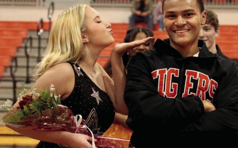 Rylan McClure strikes a pose with Karmine Mendez. Jordan Vaughn blows a kiss to her escort Xavier Wilson.