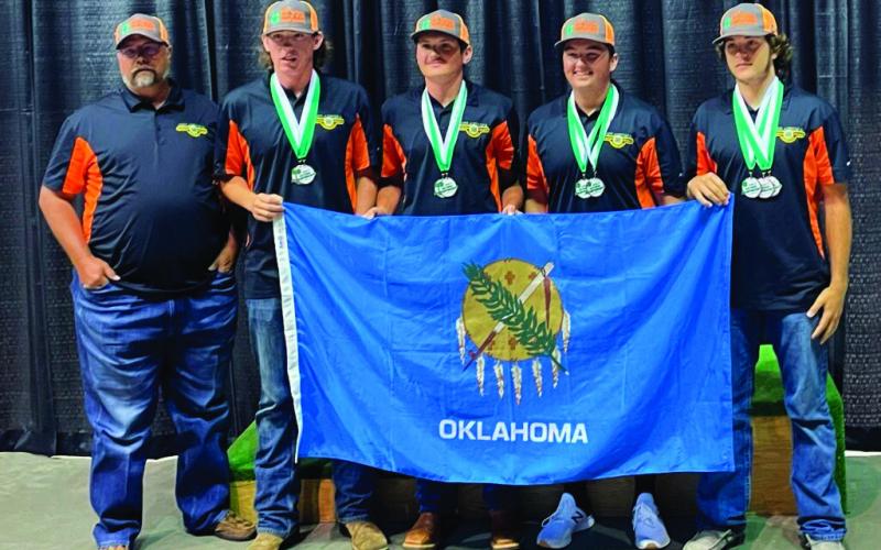 From left to right: Coach Dewayne Skidgel, Alexander Palmer, Tanner Moles, Evan Beck and Tagun Fittje.
