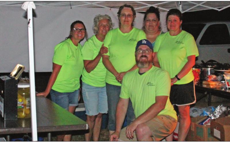 Members of ACE at the concession during outdoor movie night in Agra. Brandi Gladden, Brenda Bottger, Becky Seller, Laura Brown, Kimberly Sweet, and Justin Brown
