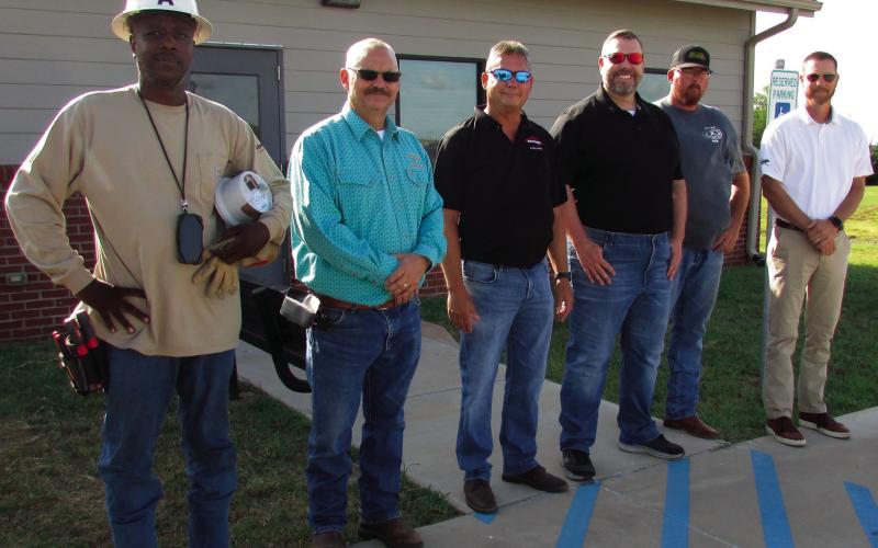 The AMI team stands together as they prepare for the first installation at the Cushing Animal Shelter. Pictured are Allegiant Utility Services install tech Quan Pugh, City of Cushing Electrical Superintendent Mike Stark, TESCO-Nighthawk Regional Manager Kevin Farrell, TESCO-Nighthawk member Jon Scott, TESCO-Nighthawk Senior Field Tech Billy Hennig, and Assistant City Manager Derek Griffith. Installs will be happening throughout the City over the next several weeks. Photo by DeAnna Maddox
