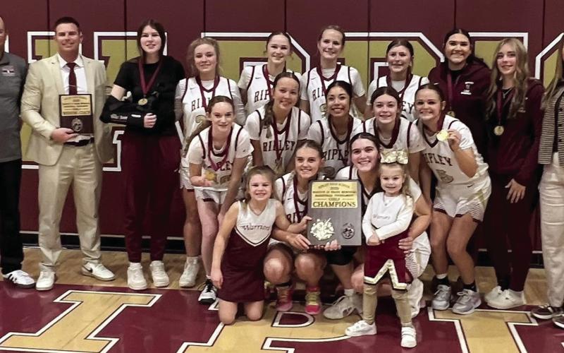 The Ripley Lady Warriors stand with their first place plaque after winning the Ripley tournament last week. The Lady Warriors beat Glencoe 41-14, Crossings Christian 54-17, and Prague 46-38.