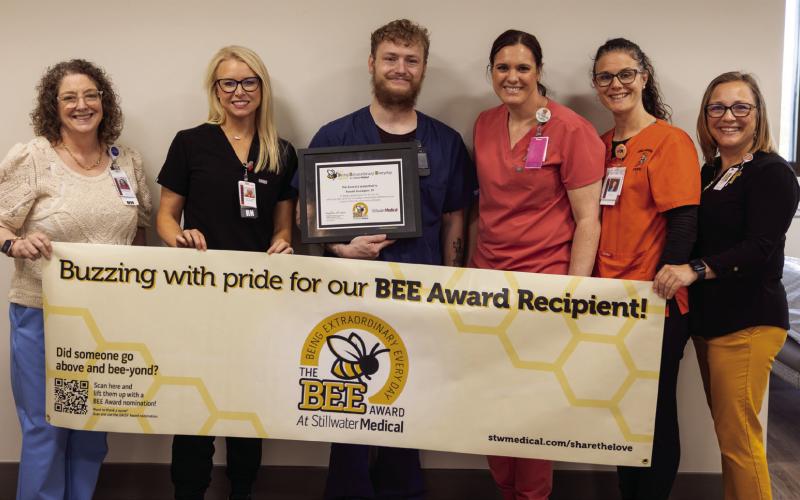 From left: Mary Beth Hunziker, Kelsey Hancock, award recipient Russell Goodgion, Alexis Gribbon, Chelsea Engle, and Deborah Aguilar, all members of the BEE committee.