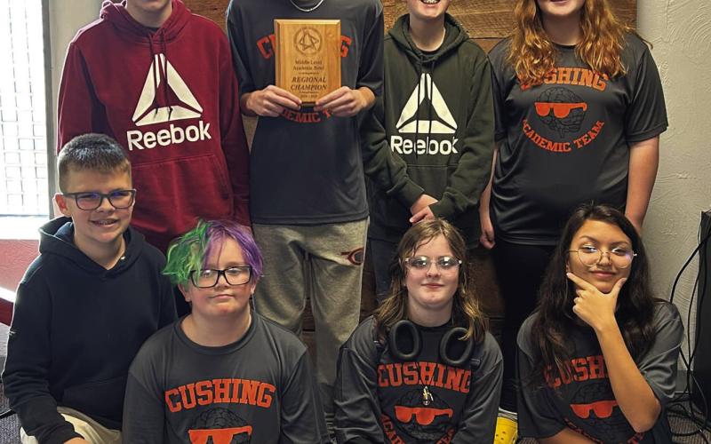 Last week Cushing Middle School Academic Team competed in Regionals and won. Pictured is the team with the plaque they received following the competition. Courtesy of Cushing Public Schools