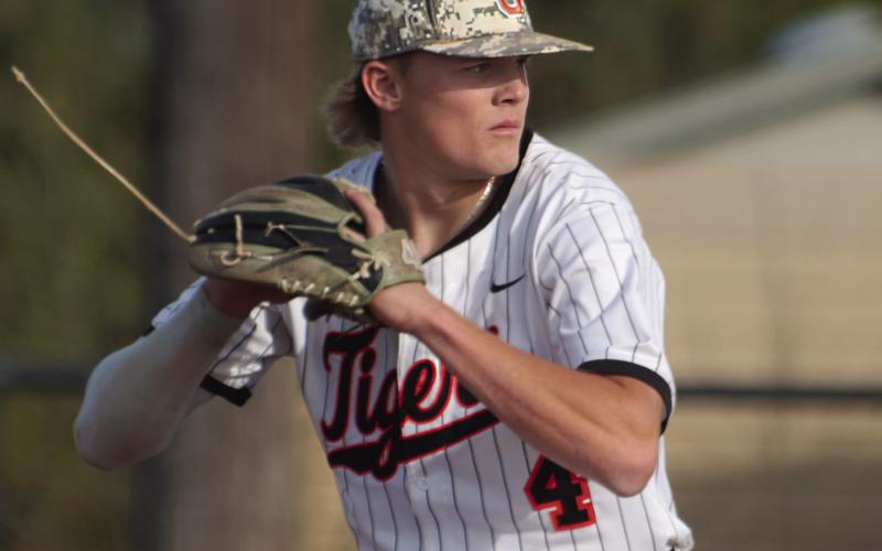 Stetson Etheridge winds up from the mound. Etheridge led off pitching for the Tigers and struck out three batters, giving up one hit.