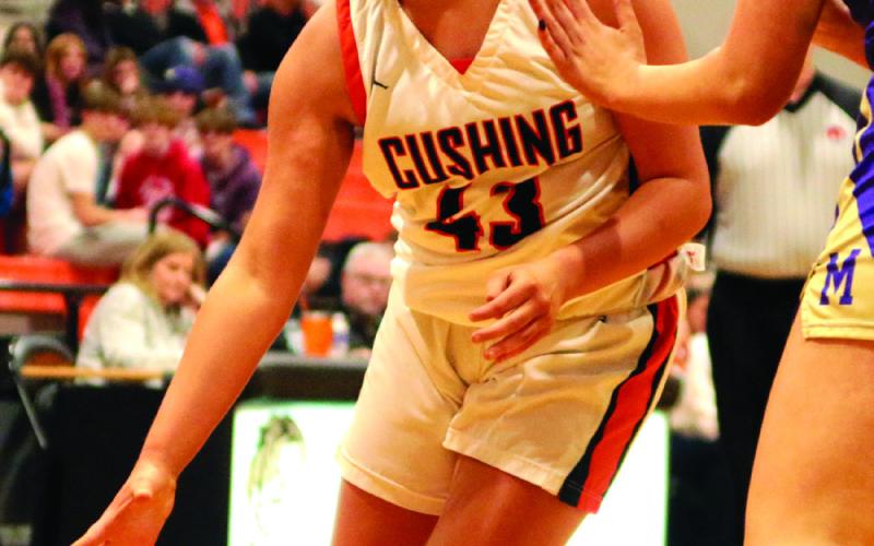 Faith Kessler fights through contact on her way to the bucket.