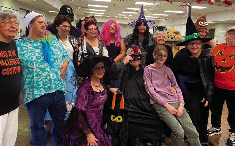 Visitors of the Cushing Senior Citizens Center enjoy Halloween festivities.