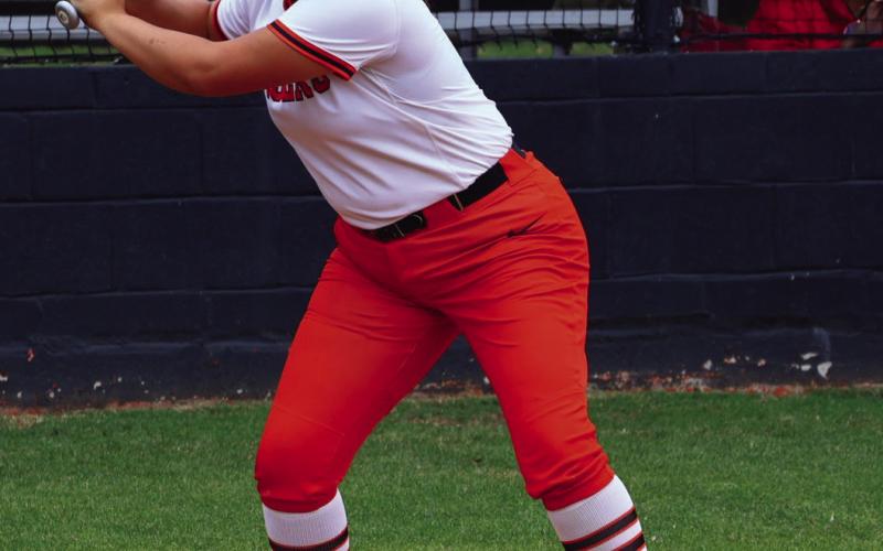 Lady Tiger Ava Hebensberger gets ready to wind up on a pitch and launch another shot over the left field wall… her favorite spot. Photo by Sylvia Danyele