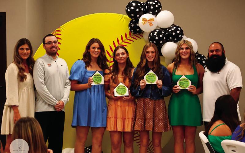 The Cushing Lady Tiger All District Lineup includes Head Coach Nikki York, assistant coach Jeff Wintz, Taylor McKiddy, first base; Matti Terrell, outfield; Harli York, player of the year; Gracyn Presley, utility and assistant coach Josh Encinas.
