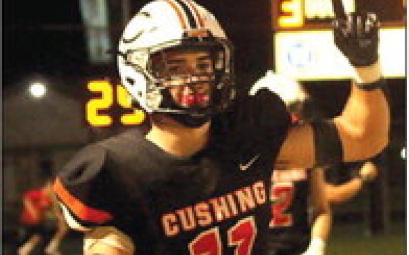 Brady Matheson celebrates after making a 52-yard touchdown run that put the Tigers up 39-28 late in the fourth quarter. Photo by J. D. Meisner