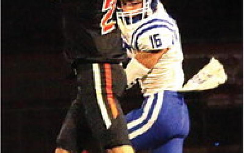 Lane Wood stretches to make a highlight-reel catch over a War Dog defender during Cushing’s 40-28 win last Friday. Photo by J. D. Meisner