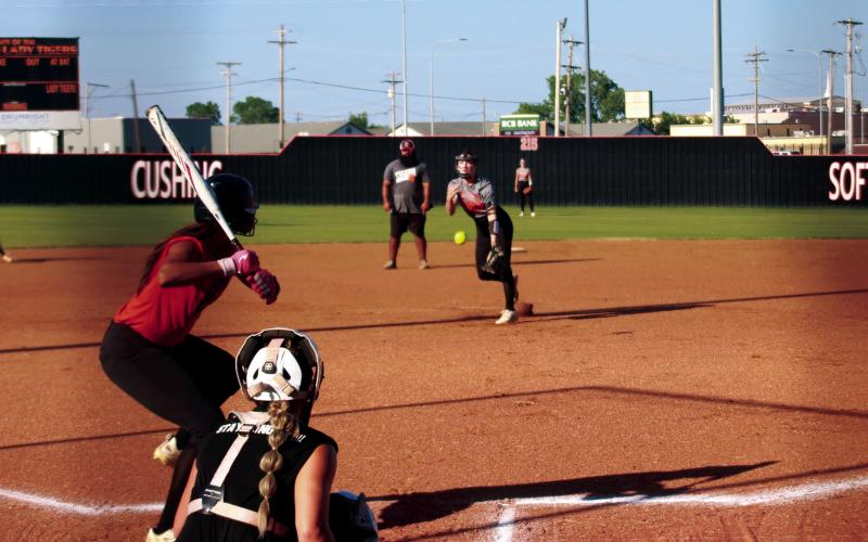 Lady Tiger Pitcher Macy Griffith delivers the heat during the Cushing Lady Tigers’ showcase Orange and Black scrimmage last Thursday. The Lady Tigers went 9-18 last season and reached the second round of the regional tournament. Photo by J. D. Meisner