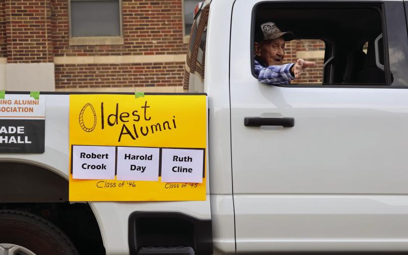Oldest CHS alum Harold Day waves to the crowd during the Homecoming Parade hosted by the CHS Alumni Association.