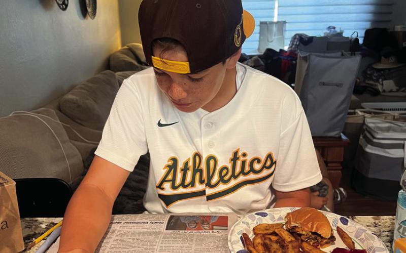 Roland Williams, 10, of Roseville, CA, reads the Cushing Citizen as he eats his lunch. Share with us on Facebook how you read your Cushing Citizen!