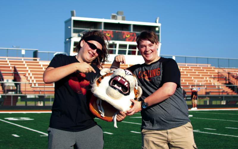 Dawson Claxton and T. J. Jenkins mug with Tony at Cushing High School’s football media days. The Tigers open their season at home on Friday, Sept. 2, against Bristow.