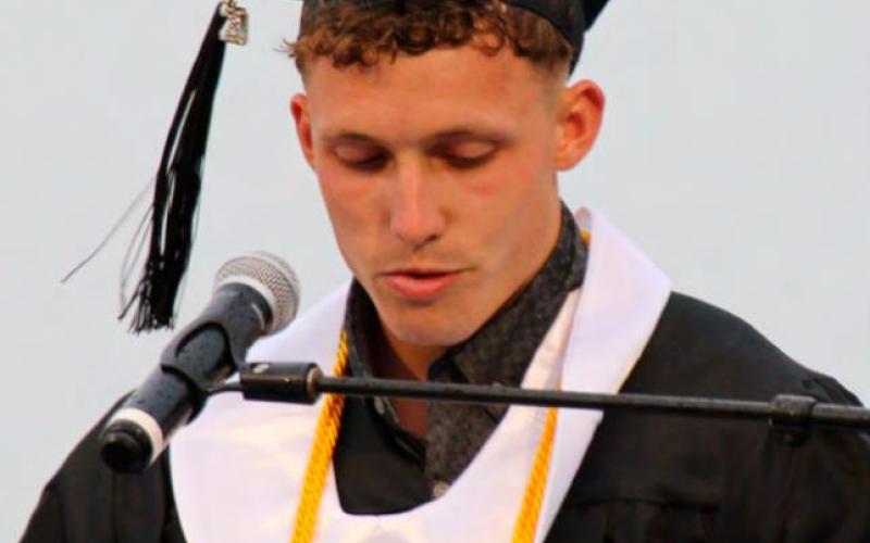 Valedictorian Keaton Crooks delivers his address, paying tribute to his parents for his success.
